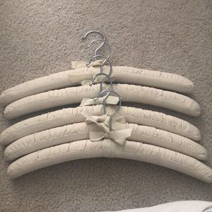 Seven canvas padded hangars